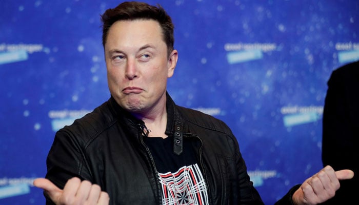 SpaceX owner and Tesla CEO Elon Musk grimaces after arriving on the red carpet for the Axel Springer award, in Berlin, Germany, December 1, 2020. — Reuters.