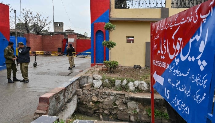 Police personnel stand guard at the entrance of Adiala jail in Rawalpindi on January 31, 2024. —AFP