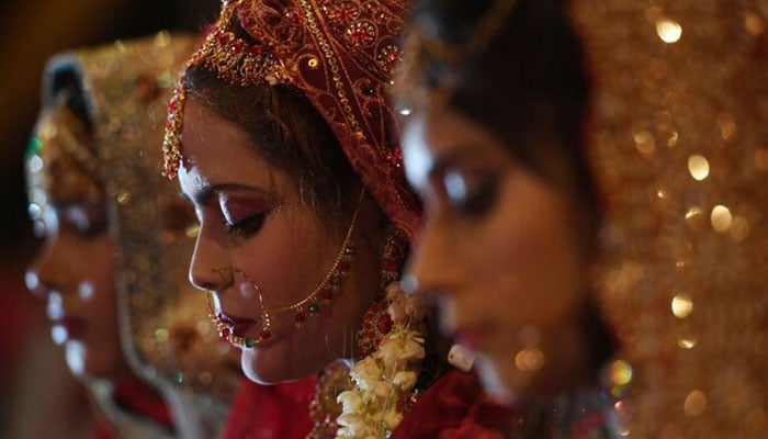 Brides attend a mass-wedding ceremony in Karachi. — AFP/File