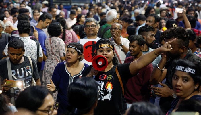 People chant slogans as they attend a protest condemning the rape and murder of a trainee medic at a government-run hospital, in Kolkata, India, October 15, 2024. — Reuters