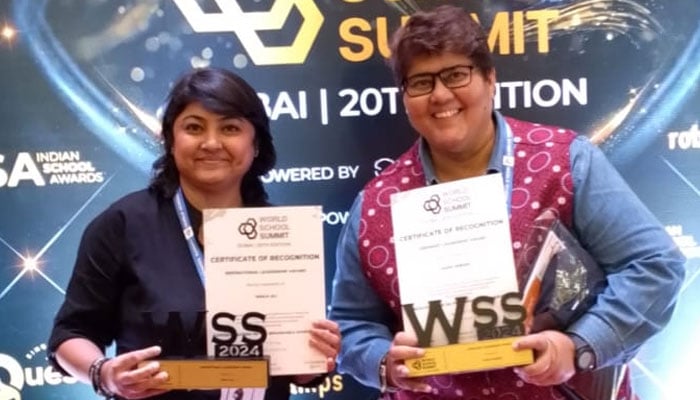 Pakistans Sadia Sheikh (right) and Naila Sheikh pose for a photo at the World School Summit in Dubai. — Reporter