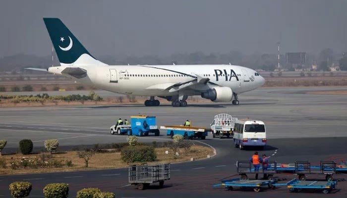 A Pakistan International Airlines (PIA) plane prepares to take off at Alama Iqbal International Airport in Lahore. — Reuters/File