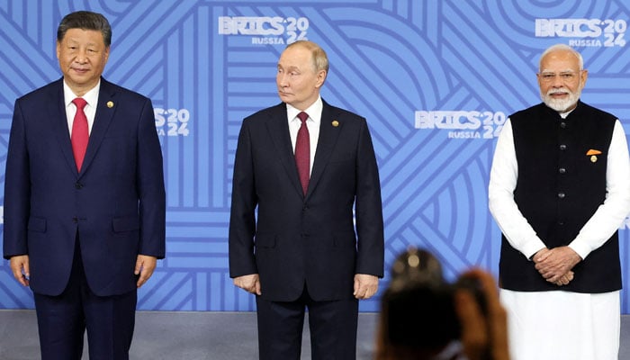 (From left to right) Chinese President Xi Jinping, Russian President Vladimir Putin and Indian Prime Minister Narendra Modi take part in a photo ceremony before a plenary session of the Brics 2024 summit in Kazan, Russia October 23, 2024. — Reuters.