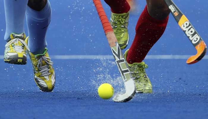 Hockey players playing the sport in this undated image. — Reuters