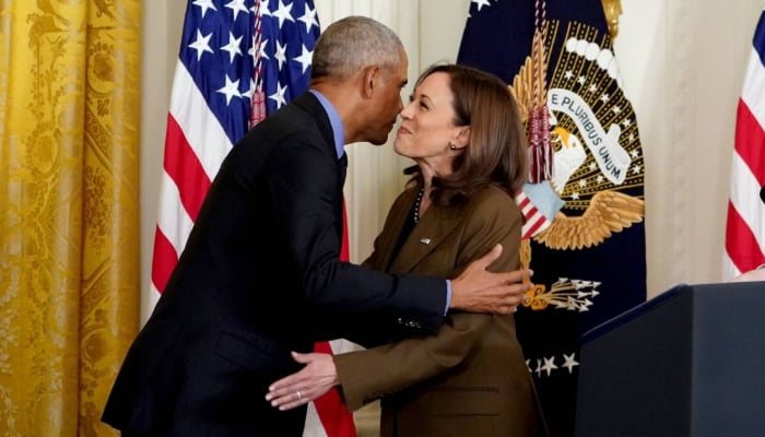 Former US President Barack Obama embraces Vice President Kamala Harris while arriving to speak on the Affordable Care Act and Medicaid in the East Room of the White House in Washington in April 2022.—AFP