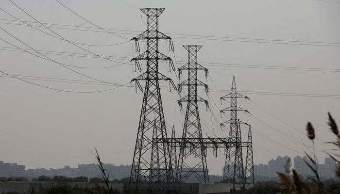 A power transmission tower in Karachi, January 24, 2023. — Reuters