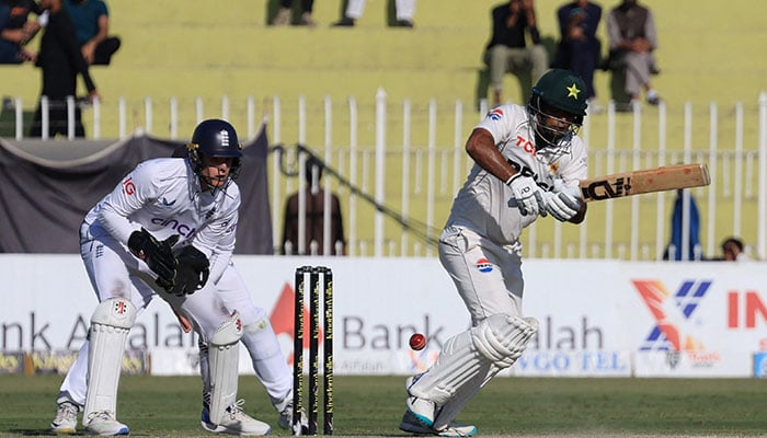 Players from Pakistan and England teams during the second day of the third Test in Rawalpindi. — Reuters