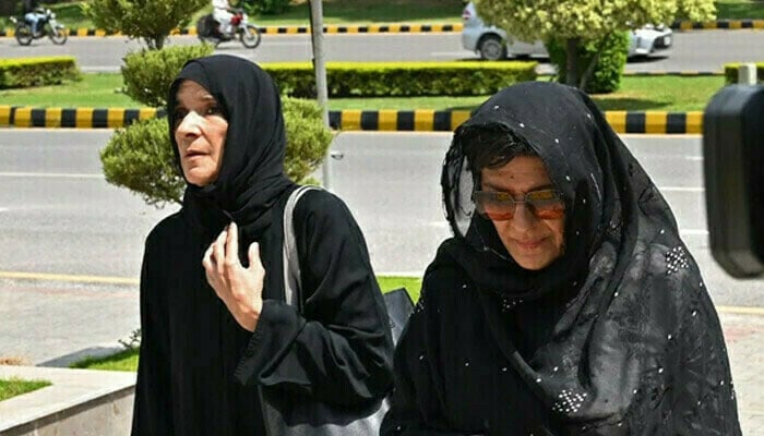 PTI founder Imran Khans sister Aleema Khan and Uzma Khan. — AFP/File