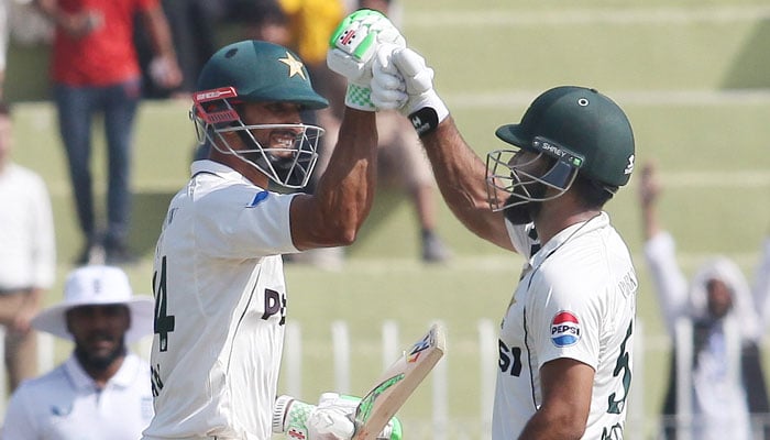 Pakistans skipper Shan Masood and Abdullah Shafique react after winning the third and final Test against England at the Rawalpindi Cricket Stadium on October 26, 2024. — PCB