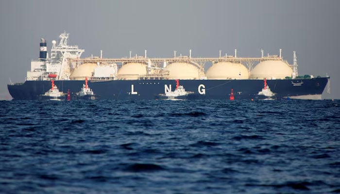 A liquefied natural gas (LNG) tanker is tugged towards a thermal power station. — Reuters/File