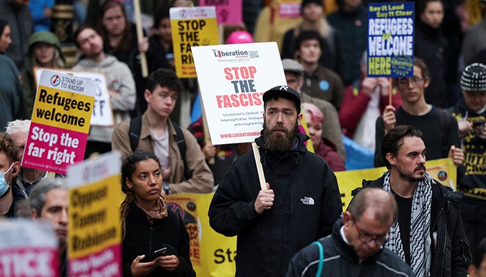 Counter-protesters take part in a demonstration against Stephen Yaxley-Lennon, a British anti-immigration activist known as Tommy Robinson and the far-right, during a march organised by Stand Up To Racism and other groups, in London, Britain, October 26, 2024. — Reuters