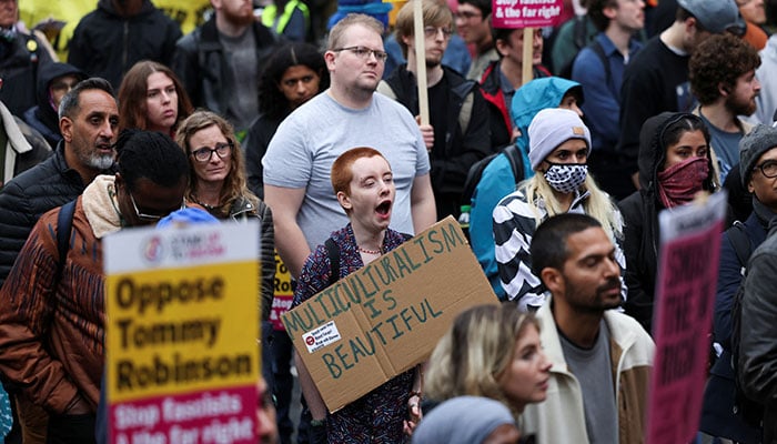 Counter-protesters take part in a demonstration against Stephen Yaxley-Lennon, a British anti-immigration activist known as Tommy Robinson and the far-right, during a march organised by Stand Up To Racism and other groups, in London, Britain, October 26, 2024. — Reuters