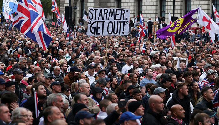 People attend an anti-immigration protest, in London, Britain, October 26, 2024. — Reuters