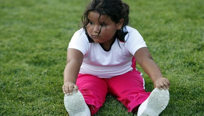 A little girl stretches at a group exercise session in the 10-week Shapedown Program at The Childrens Hospital in Aurora, Colorado.— Reuters/File