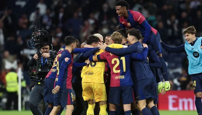 FC Barcelona players celebrate at the end of their La Liga match vs Real Madrid on October 26, 2024. — AFP