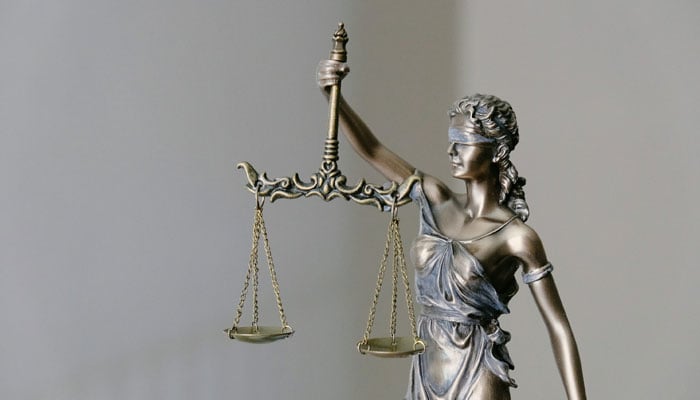 A representational image showing the scales of justice. — Unsplash