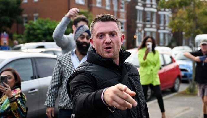 Anti-immigration activist Stephen Yaxley-Lennon, known as Tommy Robinson, gestures before arriving at Folkestone Police Station in Folkestone, Britain, October 25, 2024. — Reuters