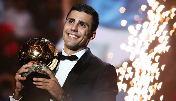 Manchester Citys Spanish midfielder Rodri receives the Ballon dOr award during the 2024 Ballon dOr France Football award ceremony at the Theatre du Chatelet in Paris on October 28, 2024. — AFP