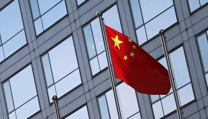 A Chinese flag flutters outside the China Securities Regulatory Commission (CSRC) building on the Financial Street in Beijing, China February 8, 2024.—Reuters