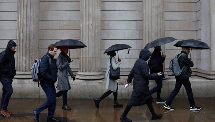 Commuters walk during the morning rush hour near the Bank of England in the City of London financial district in London, Britain, February 8, 2024. — Reuters