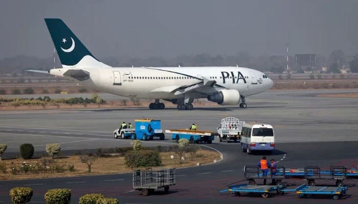 A Pakistan International Airlines (PIA) plane prepares to take-off at Alama Iqbal International Airport in Lahore. — Reuters/File