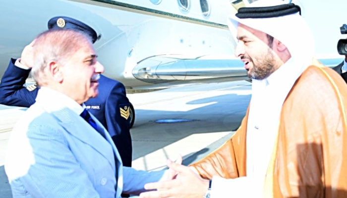 Qatars Minister of State Muhammad bin Abdulaziz Al-Khulaifi (right) receives Prime Minister Shehbaz Sharif at Doha International Airport on October 30, 2024. — X/PTV