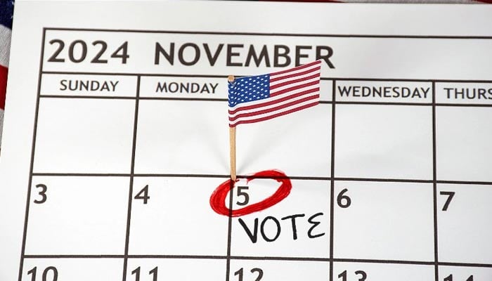 A representational image shows a small American flag marked on November 5 on a calendar as a reminder for the US election. — Canva/File