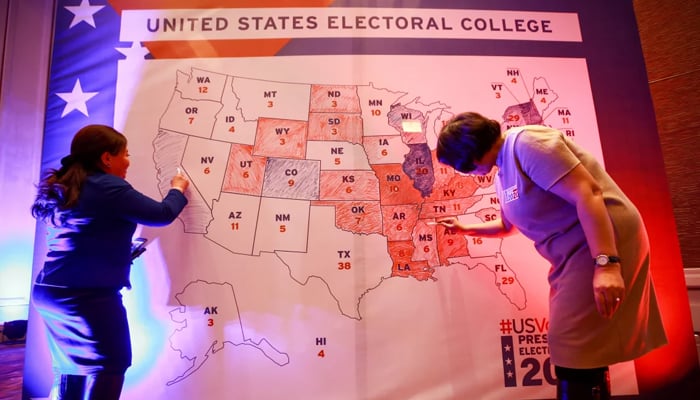 People colour in a US electoral map during a 2020 presidential election watch party at the US Embassy in Ulaanbaatar, Mongolia. — AFP