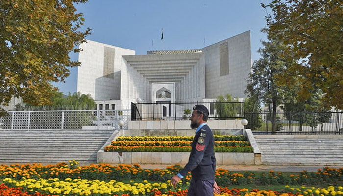 A policeman walks past the Supreme Court building in Islamabad on November 28, 2019. — AFP