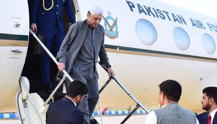 President Asif Ali Zardari coming out of plane at Nawabshah Airport. — APP/File