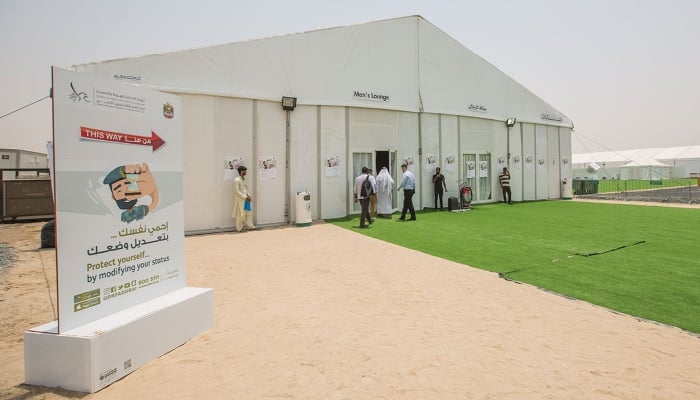 People can be seen entering a visa processing centre in Dubai. — Arabian Business