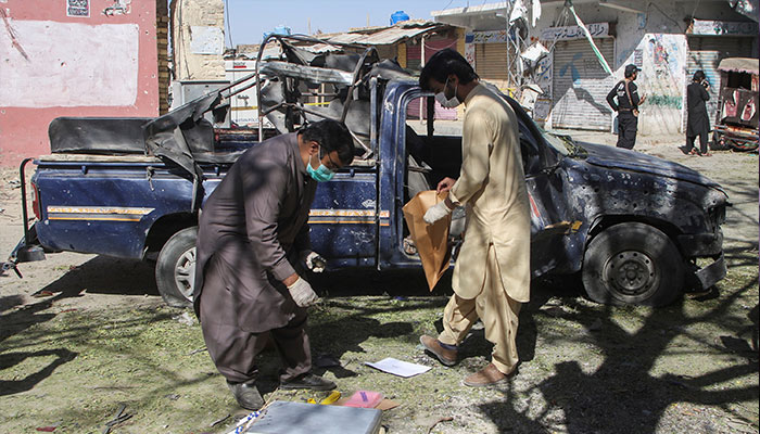 Members of a bomb disposal squad collect evidence as they investigate a crime scene after a blast in Mastung on November 1, 2024. — Reuters