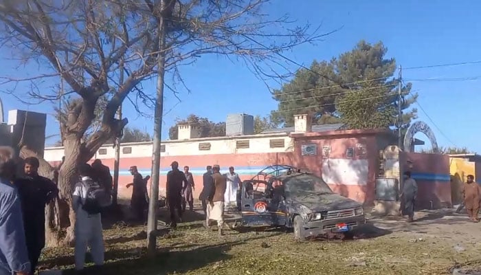 A damaged police vehicle is present at the site of the blast. — Screengrab via video by reporter