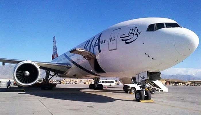 This undated photo shows a Pakistan International Airlines aircraft parked on a taxiway at an airport. — AFP