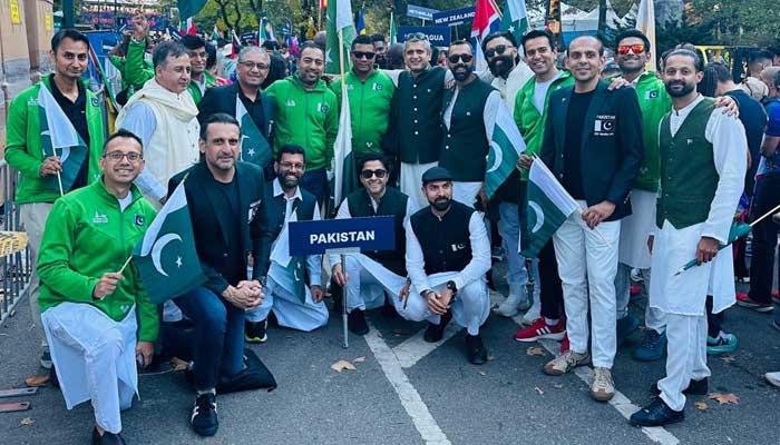 Pakistani athletes pose for a photo during the Parade of Nations ahead of New York City Marathon. — Reporter