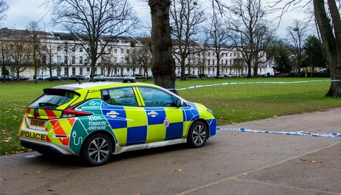 A representational image shows a parked police car. — Unsplash