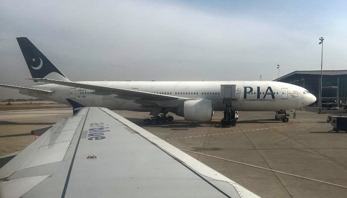 PIA passenger plane sits on tarmac, as seen through a plane window, at the Islamabad International Airport, Islamabad, on October 27, 2024. —Reuters