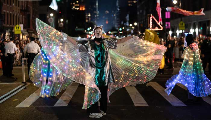 A representational image showing people wearing costumes during a Halloween parade. — AFP/File