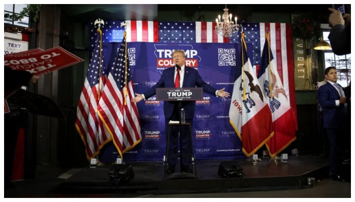 Former US President and Republican presidential candidate Donald Trump rallies with supporters at a commit to caucus event at a Whiskey bar in Ankeny, Iowa, US December 2, 2023.— Reuters