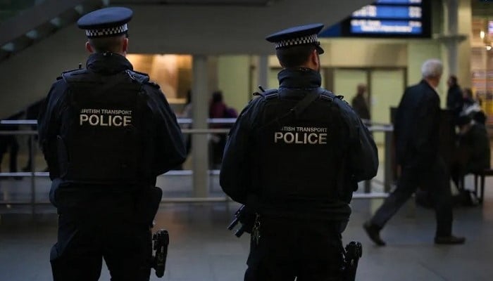 Armed British Transport Police officers patrol the Eurostar platforms in London. — AFP