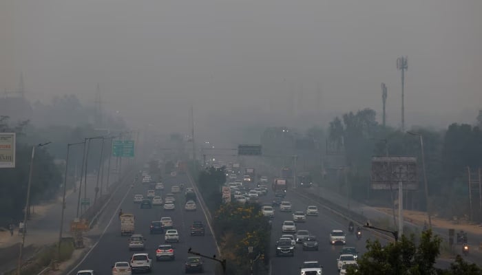 Vehicles ride past on an expressway on a smoggy morning in New Delhi, on October 31, 2024. —Reuters