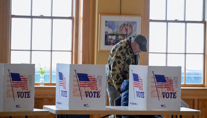 A voter fills out a ballot to vote in New Hampshires first-in-the-nation US presidential primary election at the Medallion Opera House in Gorham, New Hampshire, US, January 23, 2024. — Reuters