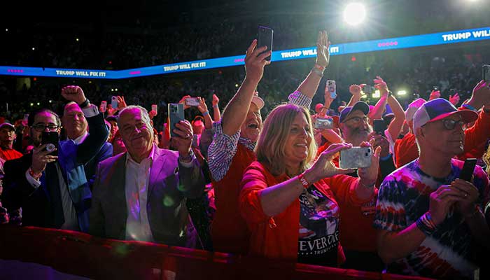 Supporters cheer at a Republican presidential nominee and former US president Donald Trump campaign rally at Van Andel Arena in Grand Rapids, Michigan, US on November 5, 2024. — Reuters