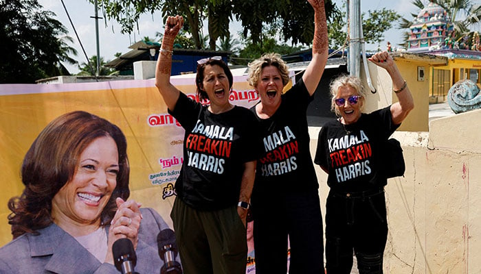 Supporters of Democratic presidential nominee and US Vice President Kamala Harris cheer for her beside a poster in Thulasendrapuram, the village where Harris maternal grandfather was born, in the Southern state of Tamil Nadu, India November 5, 2024. — Reuters