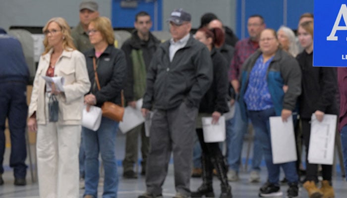 Voters wait in line to submit their ballots at Longley Elementary School in Maines 2nd congressional district on Election Day in Lewiston, Maine, US, November 5, 2024. — Reuters