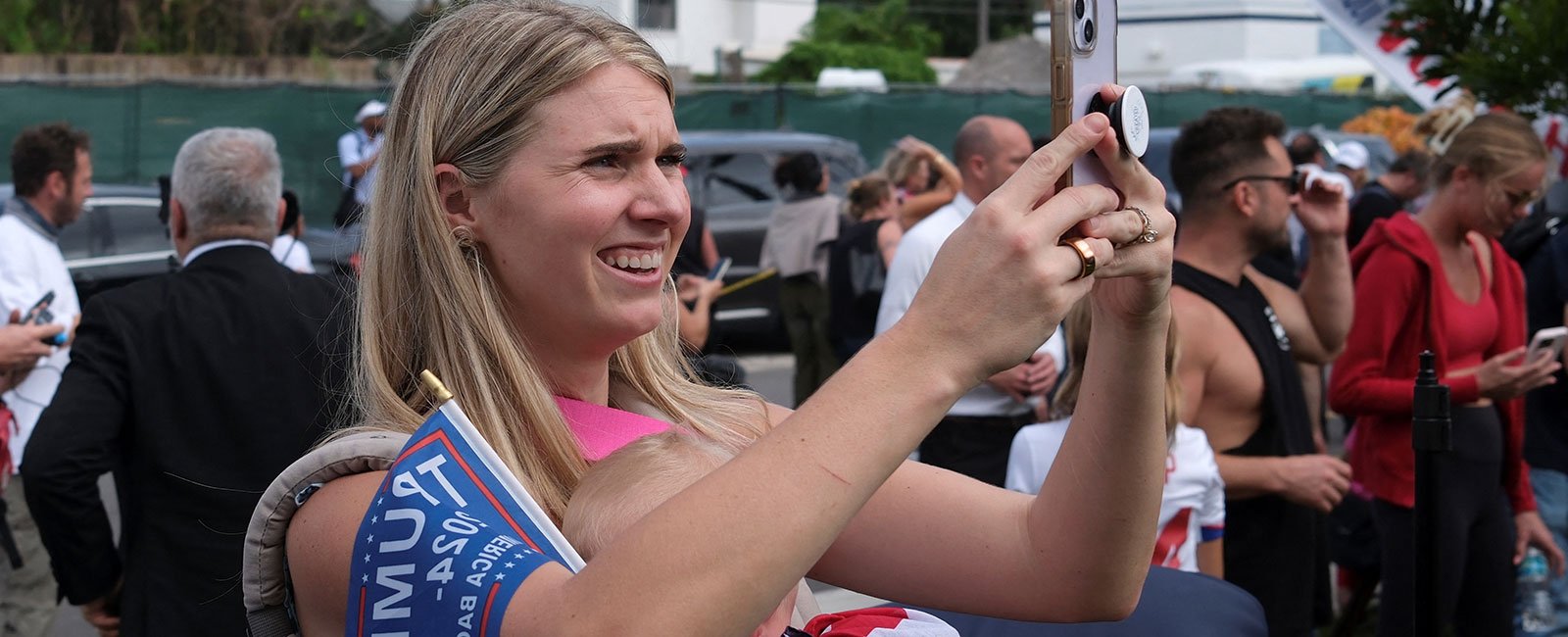 A woman uses a mobile phone as Republican presidential nominee and former US President Donald Trump and former US first lady Melania Trump are expected to vote at Mandel Recreation Center on Election Day in Palm Beach, Florida, US, November 5, 2024. — Reuters