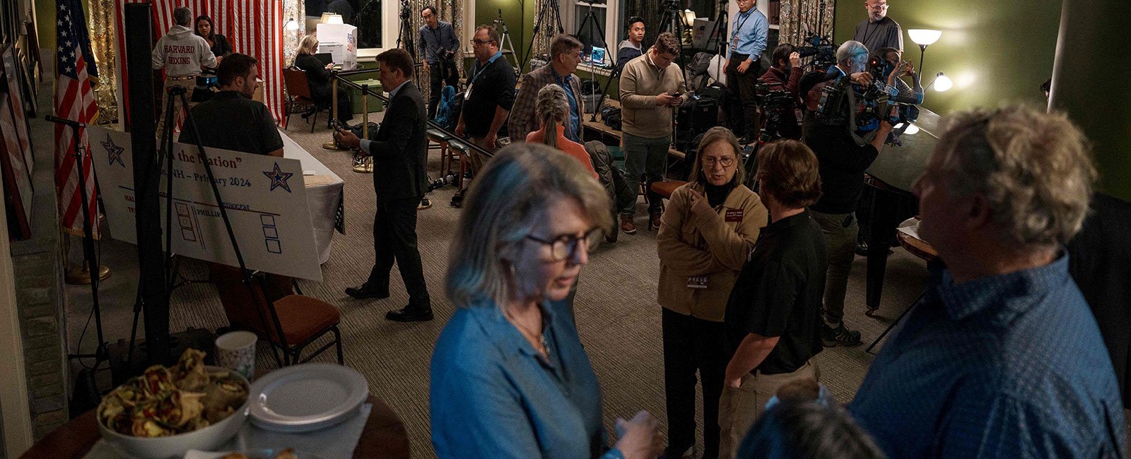 Members of the media and observers wait for six registered voters to cast their vote on November 5, 2024 in Dixville Notch, New Hampshire. — AFP