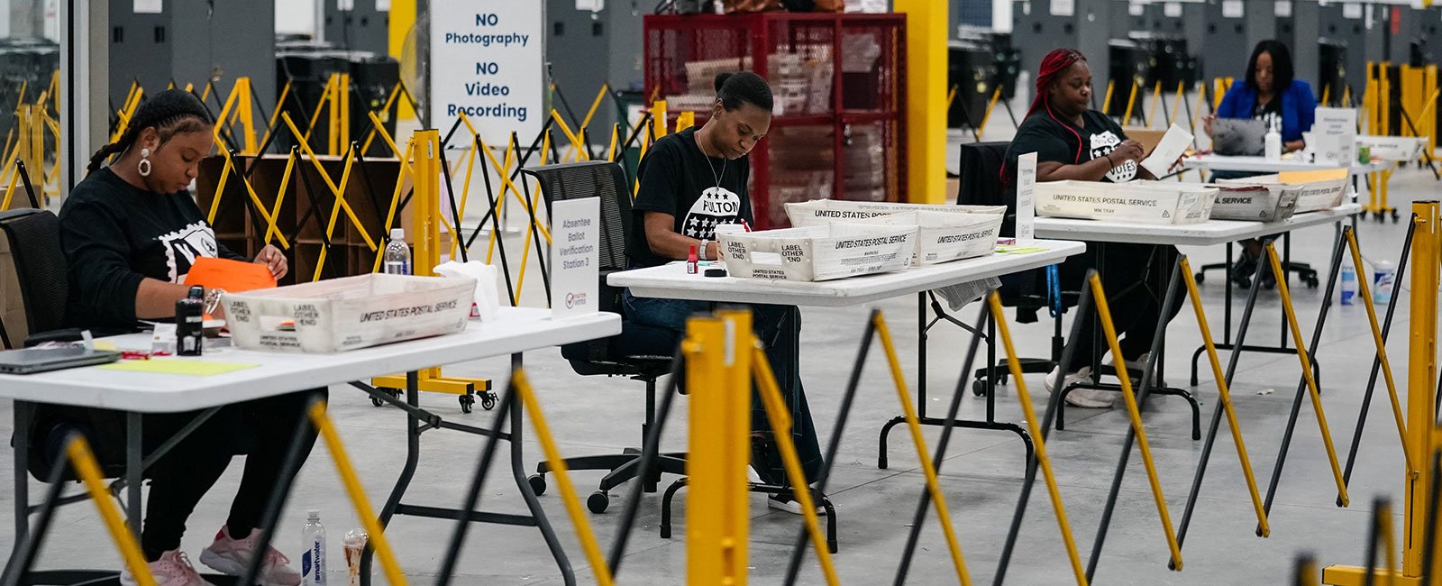 Fulton County elections workers process absentee ballots at the new Fulton County Elections Hub and Operations Center on November 4, 2024 in Union City, Georgia. — AFP