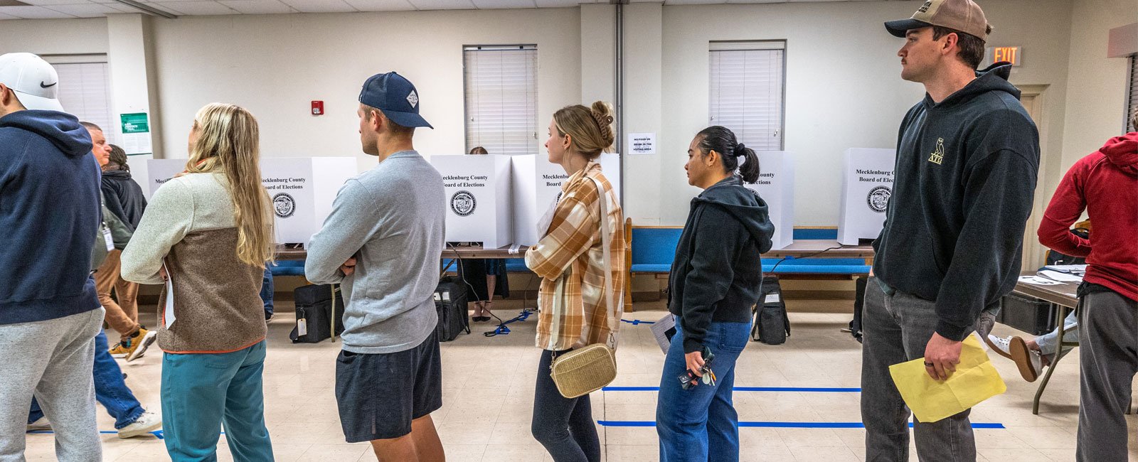 People wait in line to vote at a polling station at Greater Galilee Baptist Church in Charlotte, North Carolina on November 5, 2024. – AFP