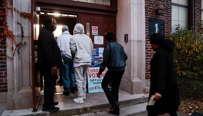 People arrive to vote at a polling station in the 2024 US presidential election on Election Day in Detroit, Michigan, US, November 5, 2024. — Reuters